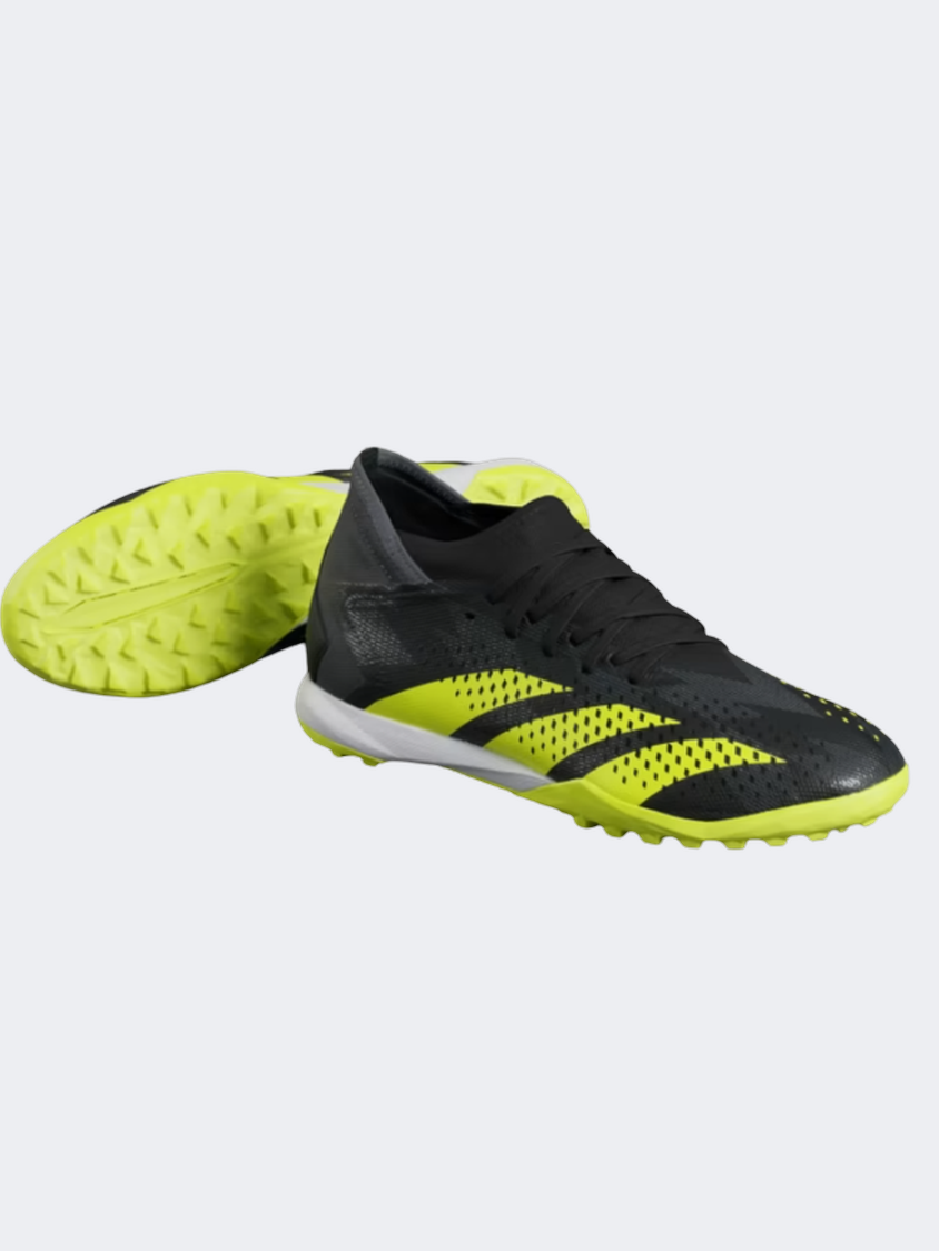 Black and yellow turf top shoes